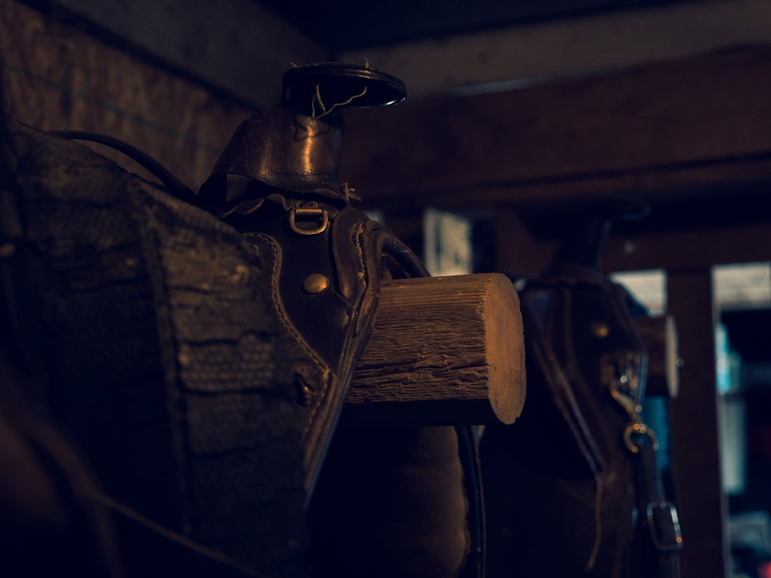 brown wooden handle on black leather textile